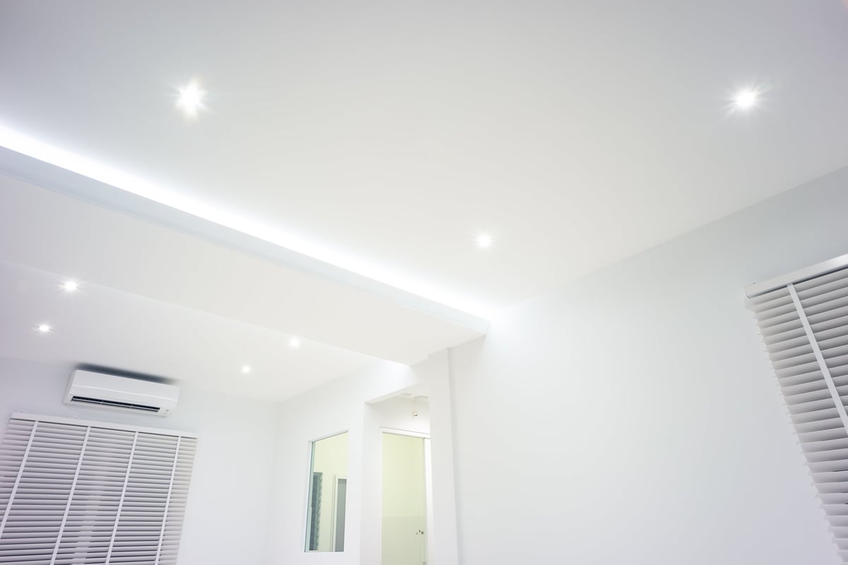LED strip light hidden in plasterboard in a modern luxury interior living room with down light