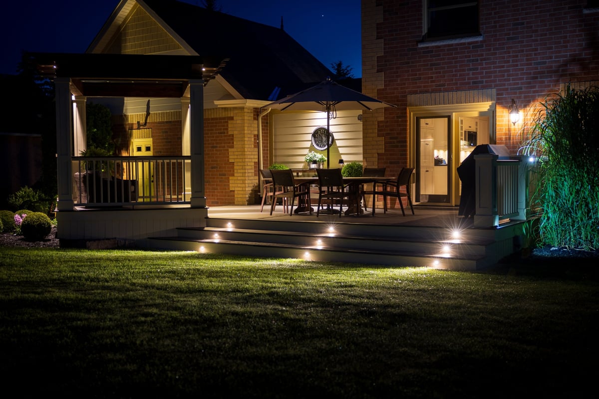 Beautiful residential deck illuminated at night