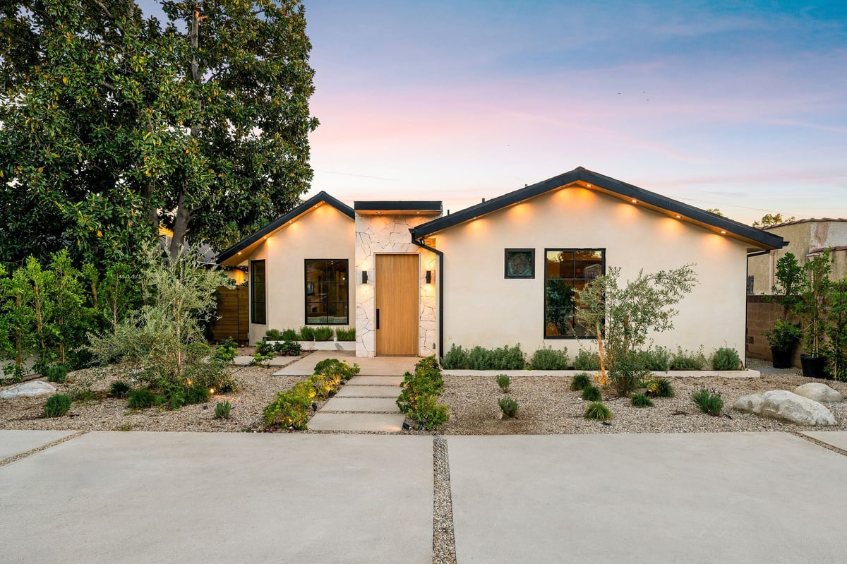 Modern single-story home with Govee exterior lighting at dusk