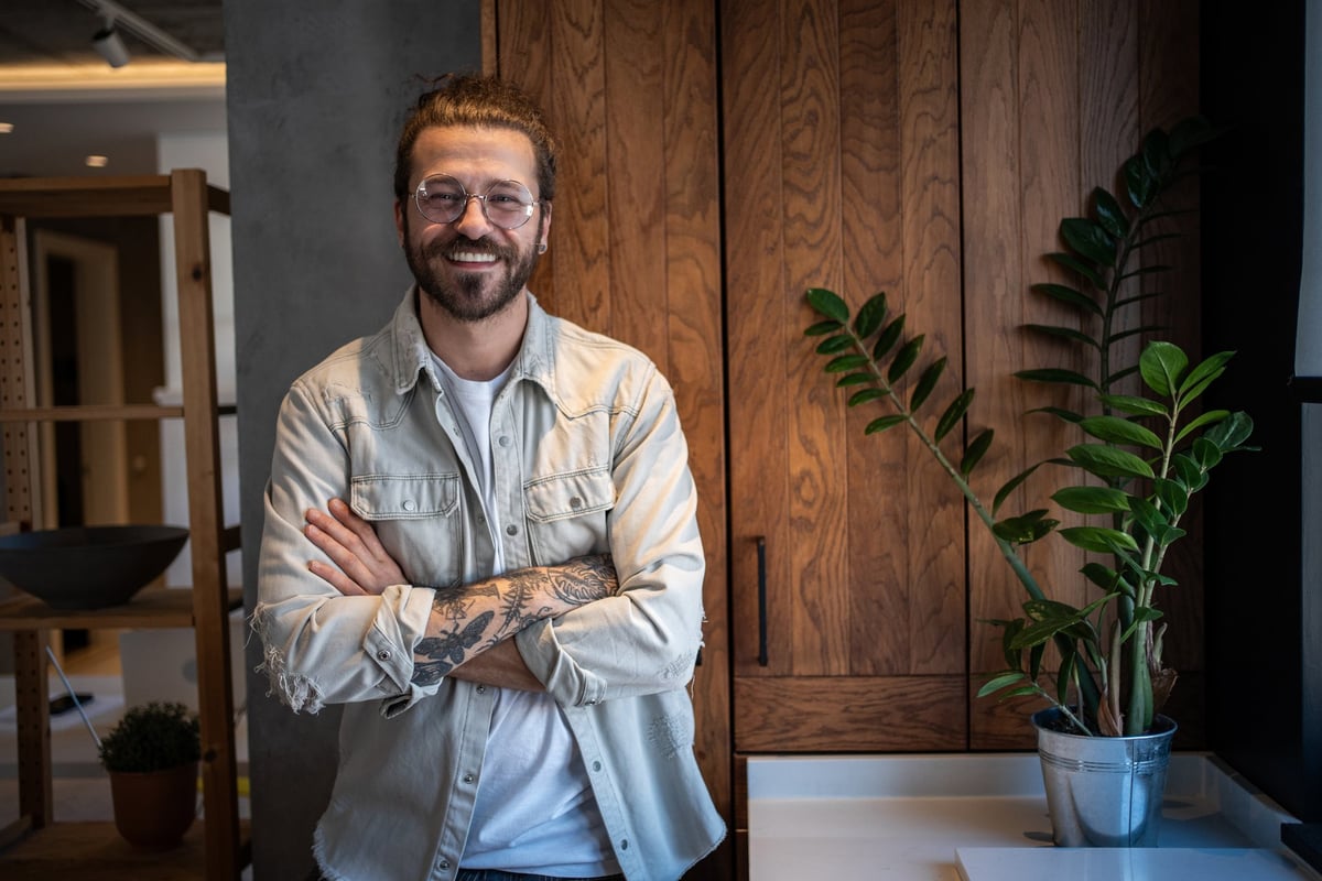 Cheerful young man standing confidently customer review