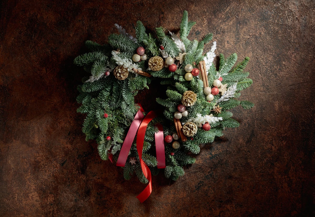 Christmas wreath made of natural fir tree branches and pine cones