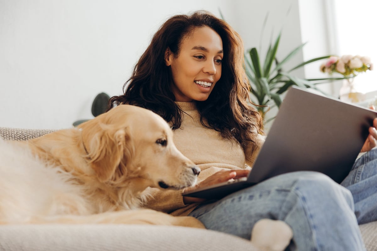 Woman working on a laptop at home customer review