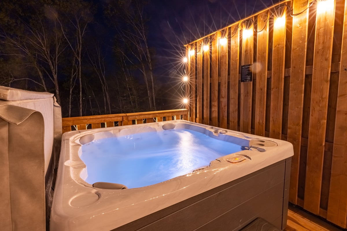 Hot tub at a glamping dome with lighting