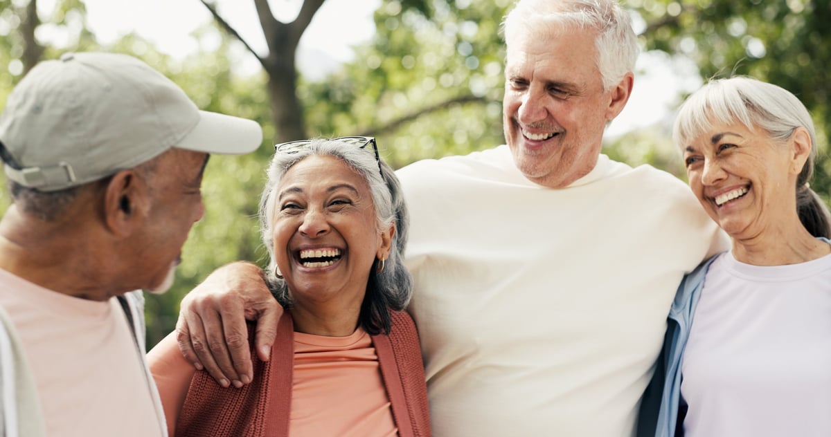 Happy seniors laughing together in a park customer review