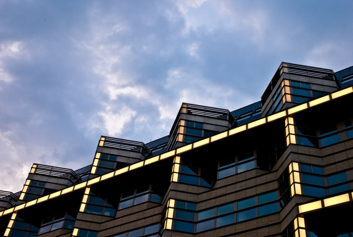 Building roofline outlined by warm golden LED lighting strips at dusk